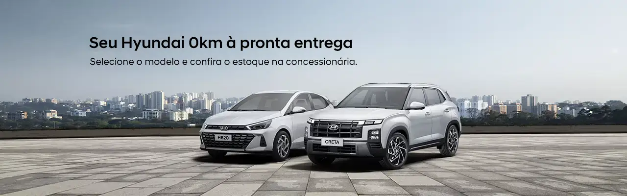 HB20 e CRETA estacionados lado a lado em rooftop com prédios de metrópole ao fundo durante o dia.